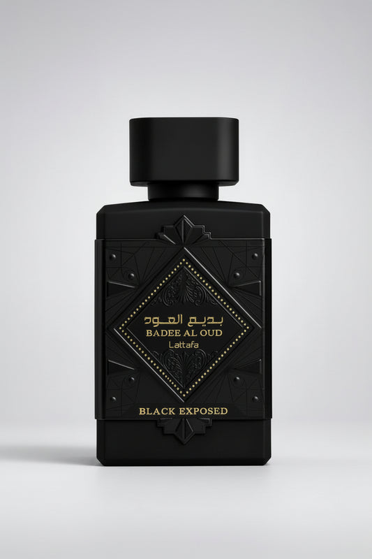 A luxury black rectangular perfume bottle with a matching black cap, featuring an embossed geometric design and a central diamond-shaped label with gold lettering that reads 'BADEE AL OUD' and 'Lattafa'.