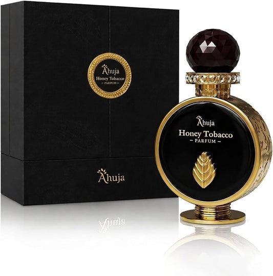 Ahuja Honey Tobacco Parfum bottle with dark glass, gold accents, and faceted stopper next to black box packaging.