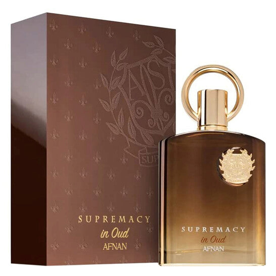 Afnan Supremacy in Oud fragrance bottle with gold cap next to brown branded box