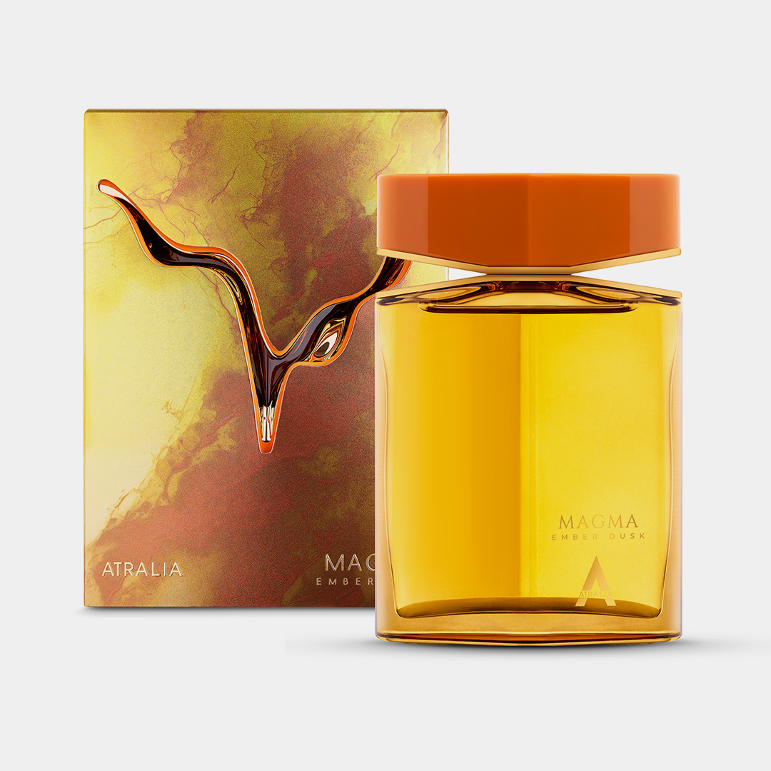 Atralia Magma Ember Dusk perfume bottle with orange cap and gold liquid beside watercolor box packaging.